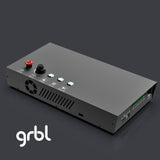 Rectangular black CNC controller with red emergency stop button, a rotary knob, four circular LED indicators, and ventilation on the side, shown on a dark surface with grbl logo.