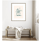 Minimalist line drawing of a flower arrangement in a vase, displayed in a wooden frame against a white wall above a bench with a book and light fabric draped over it.
