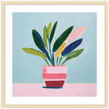 Framed abstract art print of a colorful potted plant with leaves in green, pink, yellow, and blue, set against a light blue background