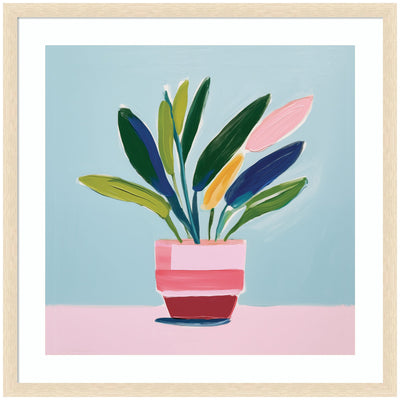 Framed abstract art print of a colorful potted plant with leaves in green, pink, yellow, and blue, set against a light blue background