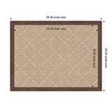 Rectangular pinboard with a beige fabric surface featuring a white lattice pattern, framed by dark wood, measuring 26 by 20 inches outer size.