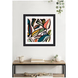 Framed abstract wall art featuring bold black outlines and colorful leaf shapes in muted pink, mustard yellow, teal, and green, hanging above a wooden console table.