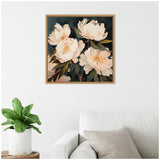 Square framed canvas painting of soft pink and white peonies with dark green leaves on a deep muted background, hanging above a white sofa with grey cushions and a leafy plant nearby.