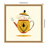 Yellow teapot with floral and leaf designs in black, green, and red on a cream background, framed in light wood, centered with lid slightly lifted.
