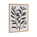 Framed print of black botanical silhouette with elongated leaves on white background in a light wood frame, shown angled from side.