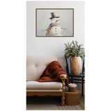 Framed portrait of a snowman with a black top hat, carrot nose, and beige scarf hangs above a beige sofa with a rust-colored throw blanket, next to a wooden chair holding a wooden vase with green foliage.
