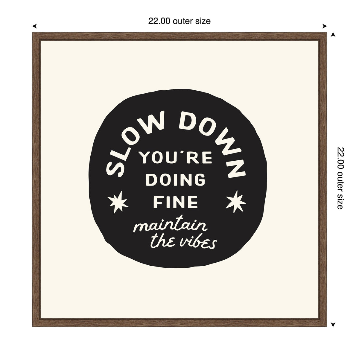 Black circular shape with white text reading 'Slow Down You're Doing Fine maintain the vibes,' framed in simple dark wood on a cream background.