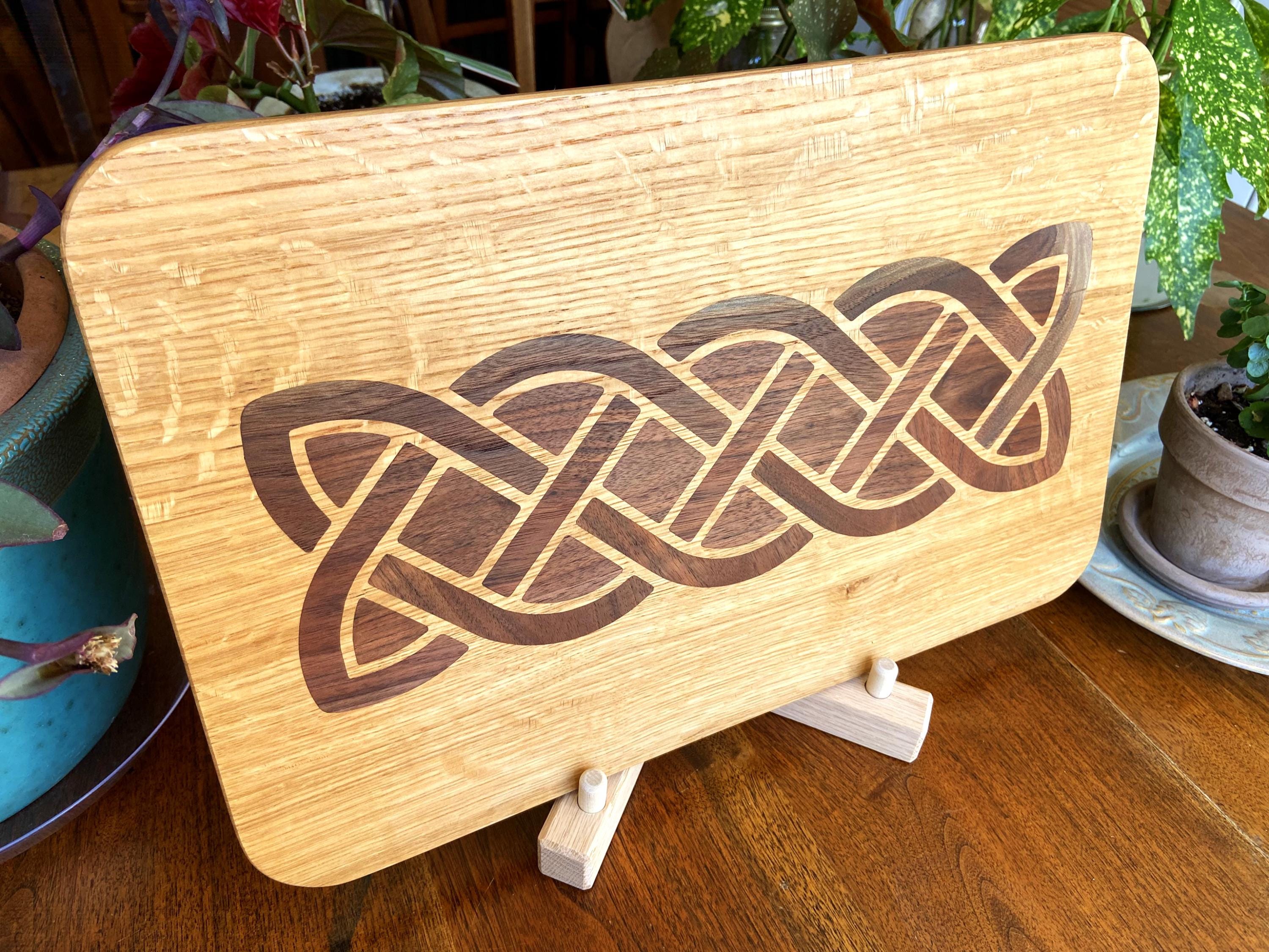 White Oak charcuterie board featuring a complex Celtic knot inlay made of Peruvian Walnut