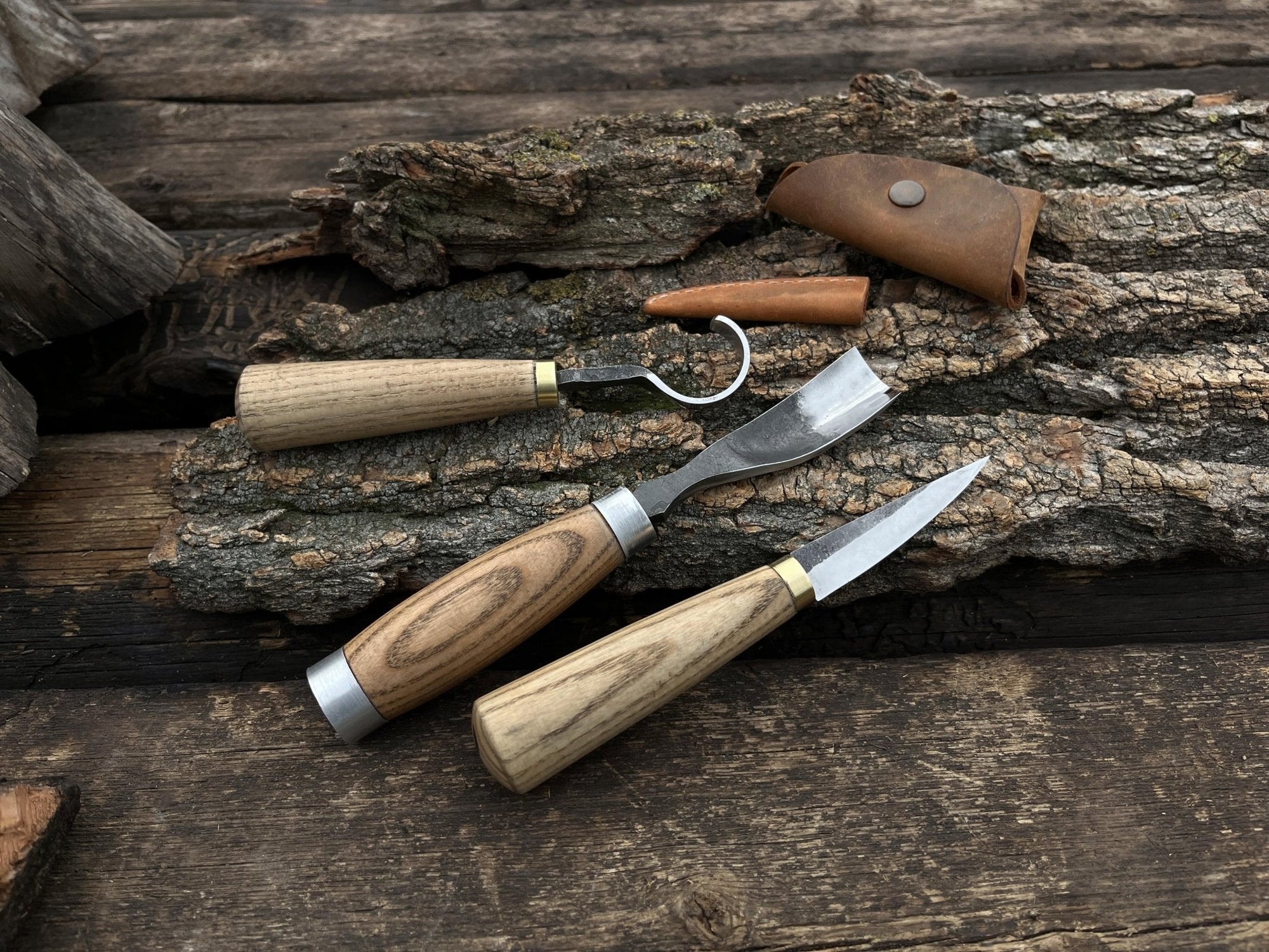 3-piece hand-forged spoon carving tool set with ash handles and leather sheaths