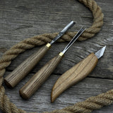 3-piece wood carving tool set with whittling knife, carving gouge, and V-parting chisel on a wooden surface