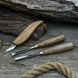 3-piece wood carving tool set with whittling knife, carving gouge, and V-parting chisel on a wooden surface