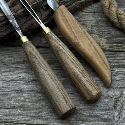 3-piece wood carving tool set with whittling knife, carving gouge, and V-parting chisel on a wooden surface