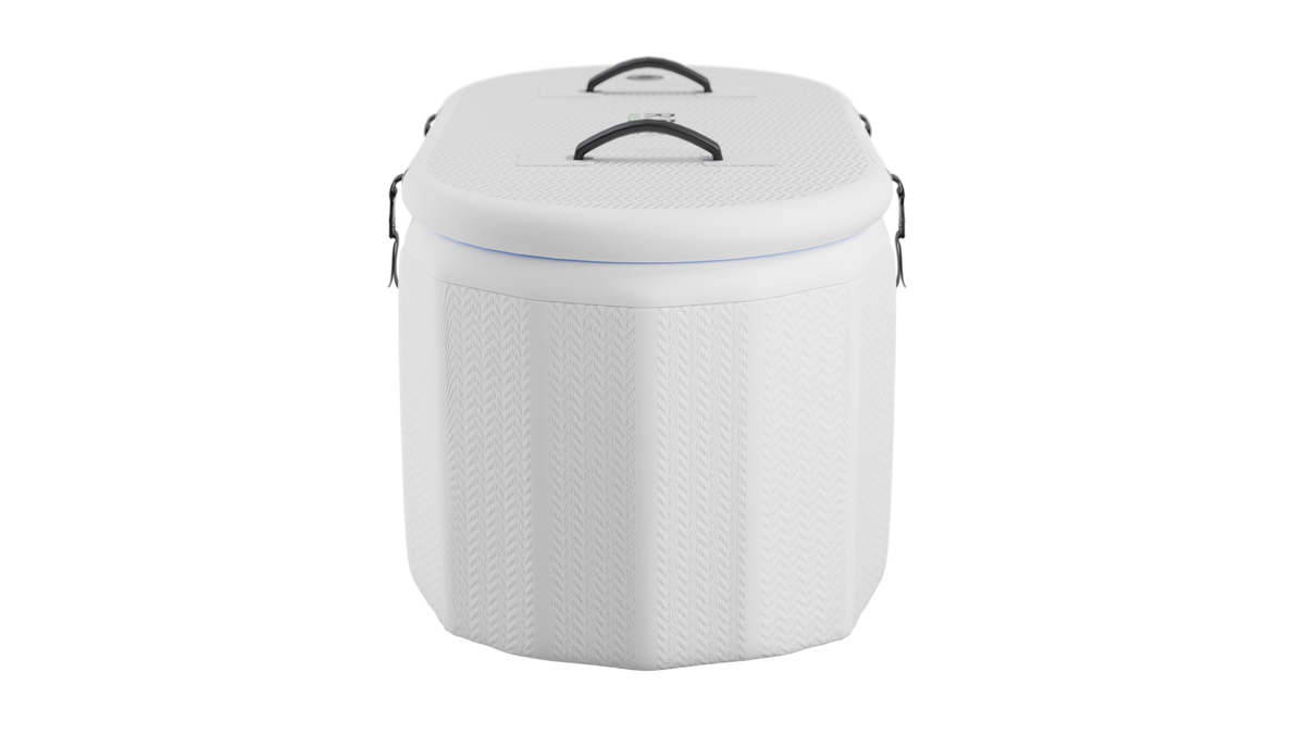 White inflatable tub with textured surface and black handles on top and sides against a black background.