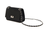 Black shoulder bag with a grid of raised square studs and a silver chain strap woven with black leather and a silver turn-lock clasp on front.