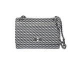 Black and white woven checkered shoulder bag with silver chain strap and rectangular turn-lock clasp on front flap.