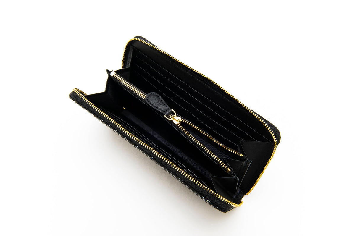 Black zipped long wallet with Seven Treasures pattern, open view showing leather interior and compartments