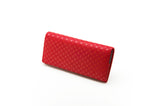 Red long wallet with a subtle floral lattice pattern in lighter red, shown closed and angled on a white background.