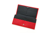 Open long wallet with a black interior featuring card slots and a red exterior patterned with small white flower lattices, shown flat on a white background.