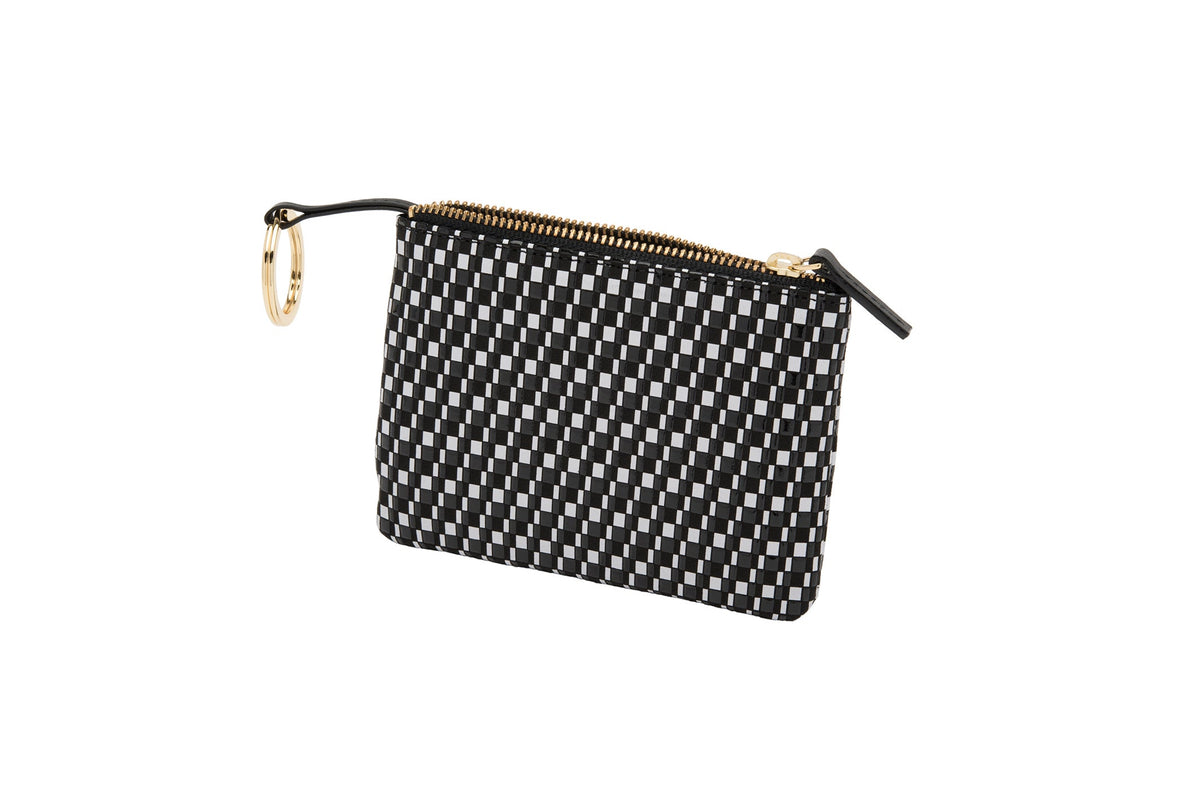 Small rectangular black and white checkered key case with a gold zipper and key ring on a white background.