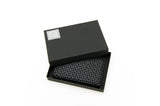 Black business card case with a geometric silver pattern inside an open black box with a silver logo on the lid corner.