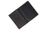 Open black leather business card case with a patterned interior flap featuring a dark brown and silver diamond design, and multiple card slots inside.