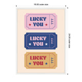 Three framed tickets stacked vertically reading 'LUCKY YOU' with stars and '777'; colors pink, navy blue, and mustard yellow on beige background.