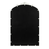 Arched mirror with black reflective surface and decorative white floral and leaf detail at the top center of the frame.