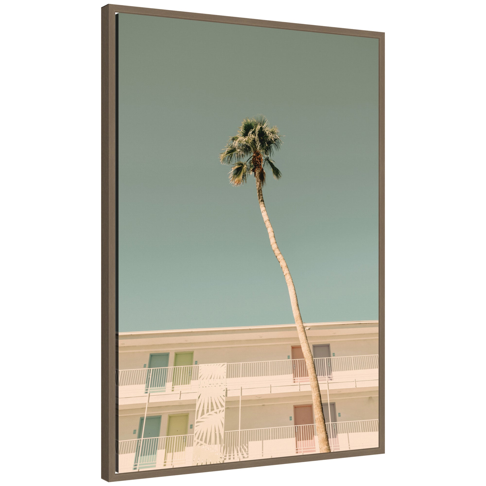 PS I Love You framed canvas wall art featuring a tall palm tree against pastel sky and colorful minimalist building framed in dark gold