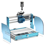 Compact desktop CNC router kit with aluminum frame, blue acrylic side panels, and a central spindle mount above a perforated white work surface