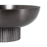 Dark metal bowl with a smooth, rounded upper section and a vertically ribbed cylindrical base, shown in close-up against a white background.
