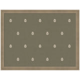 Fabric pinboard with green botanical block print framed in light brown wood, styled with photos and notes pinned