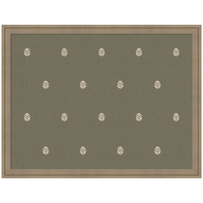Fabric pinboard with green botanical block print framed in light brown wood, styled with photos and notes pinned