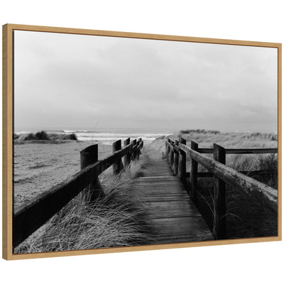 Black and white framed canvas print of coastal beach boardwalk by Patricia Hasz