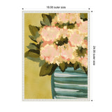 Framed canvas painting of soft pink blossoms with green leaves in a blue-striped vase on a muted yellow background, measuring 18 by 24 inches.