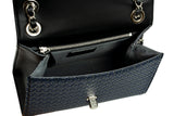 Open black and dark blue shoulder bag with diamond-patterned front flap, silver chain strap, and interior zippered compartment.
