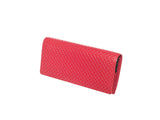 Rectangular long wallet in bright red with a repeating scale-like embossed pattern, shown closed at a slight angle against white background.
