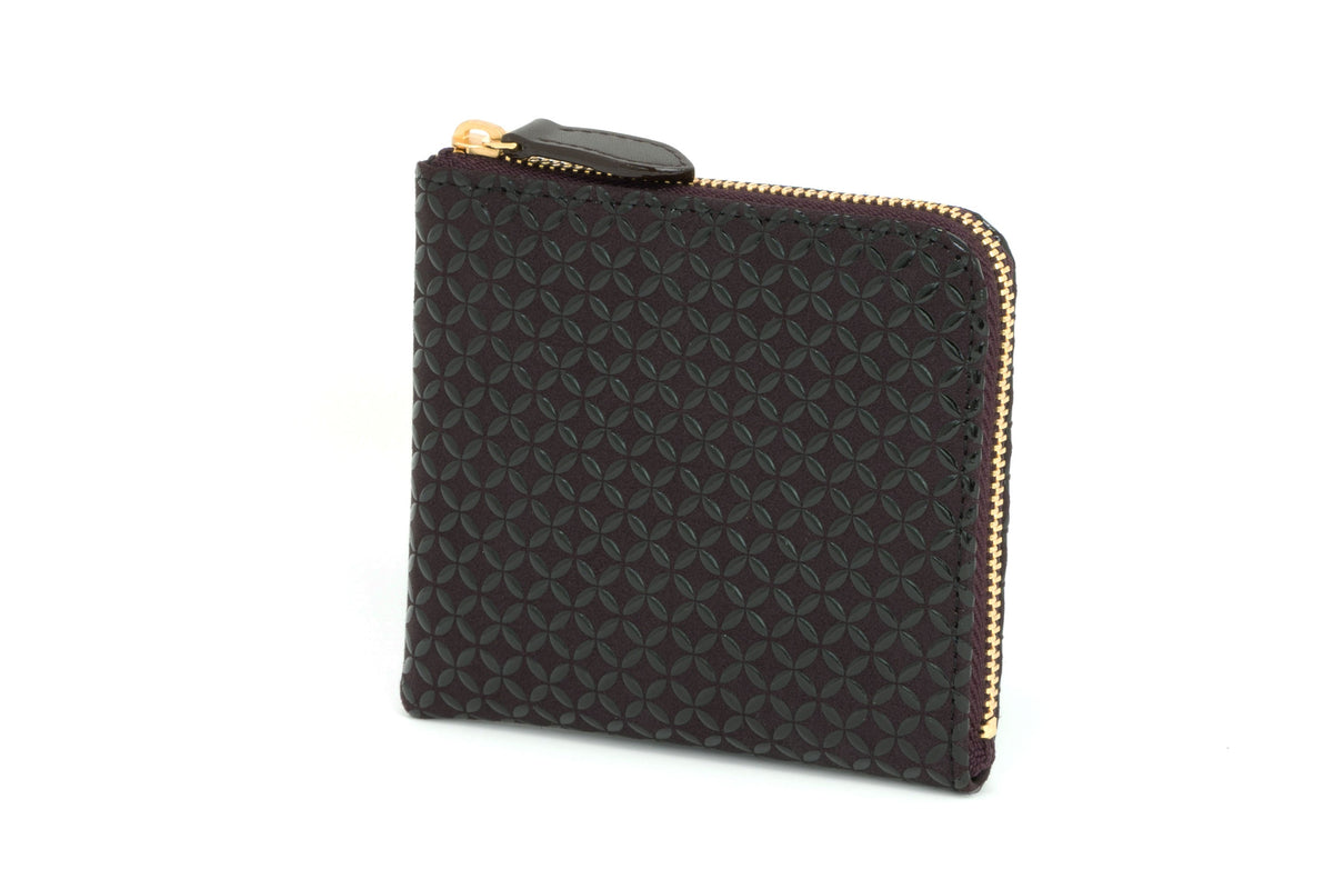 Compact black zipped coin purse with a repeating circular geometric pattern and a gold-tone zipper along the top and right edges.