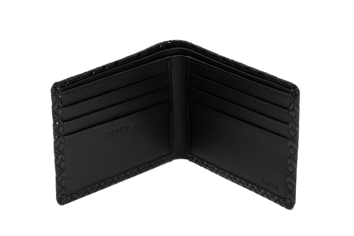 Black men's folded wallet opened flat showing six card slots on each side with subtle diamond pattern along the edges and embossed text inside.