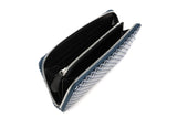 Open zipped long wallet with a white geometric grid pattern on dark blue exterior and black interior compartments with card slots and zipper pull tab.