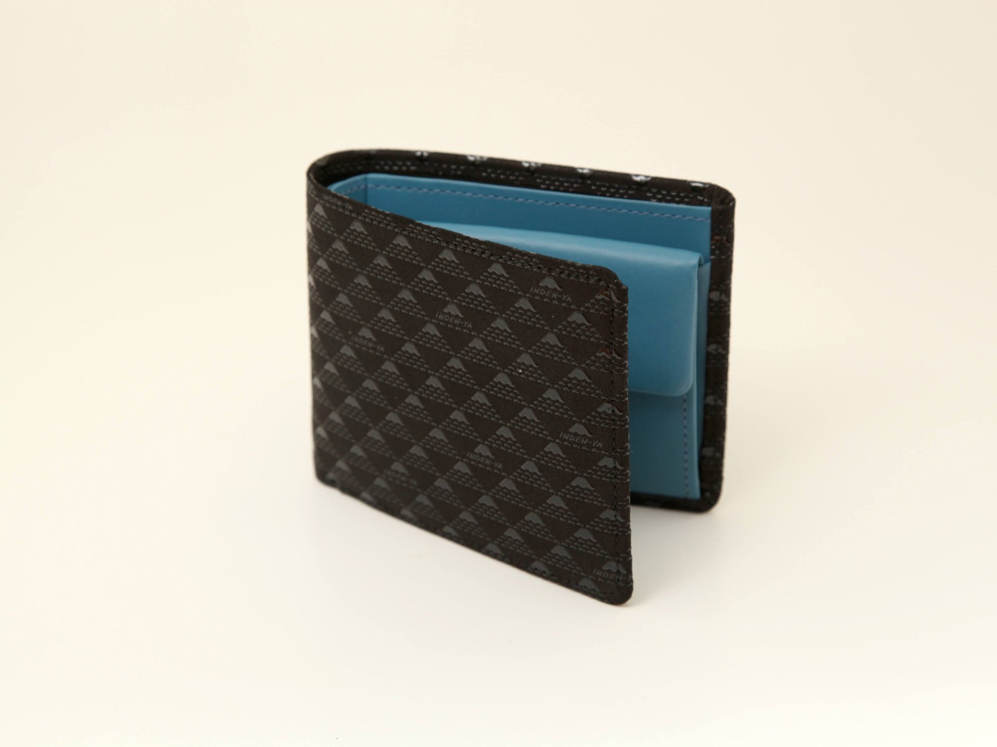Takane Folded Wallet J by Inden in Black x Black, showing bi-fold design with snap coin compartment.
