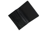 Open black business card case with a textured diamond pattern on one side and smooth interior card slots on the other.