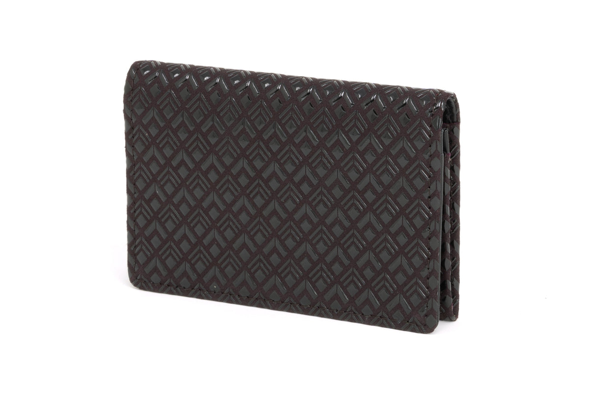 Dark brown leather business card case with an embossed diamond pattern, shown standing upright at a slight angle on a white background.