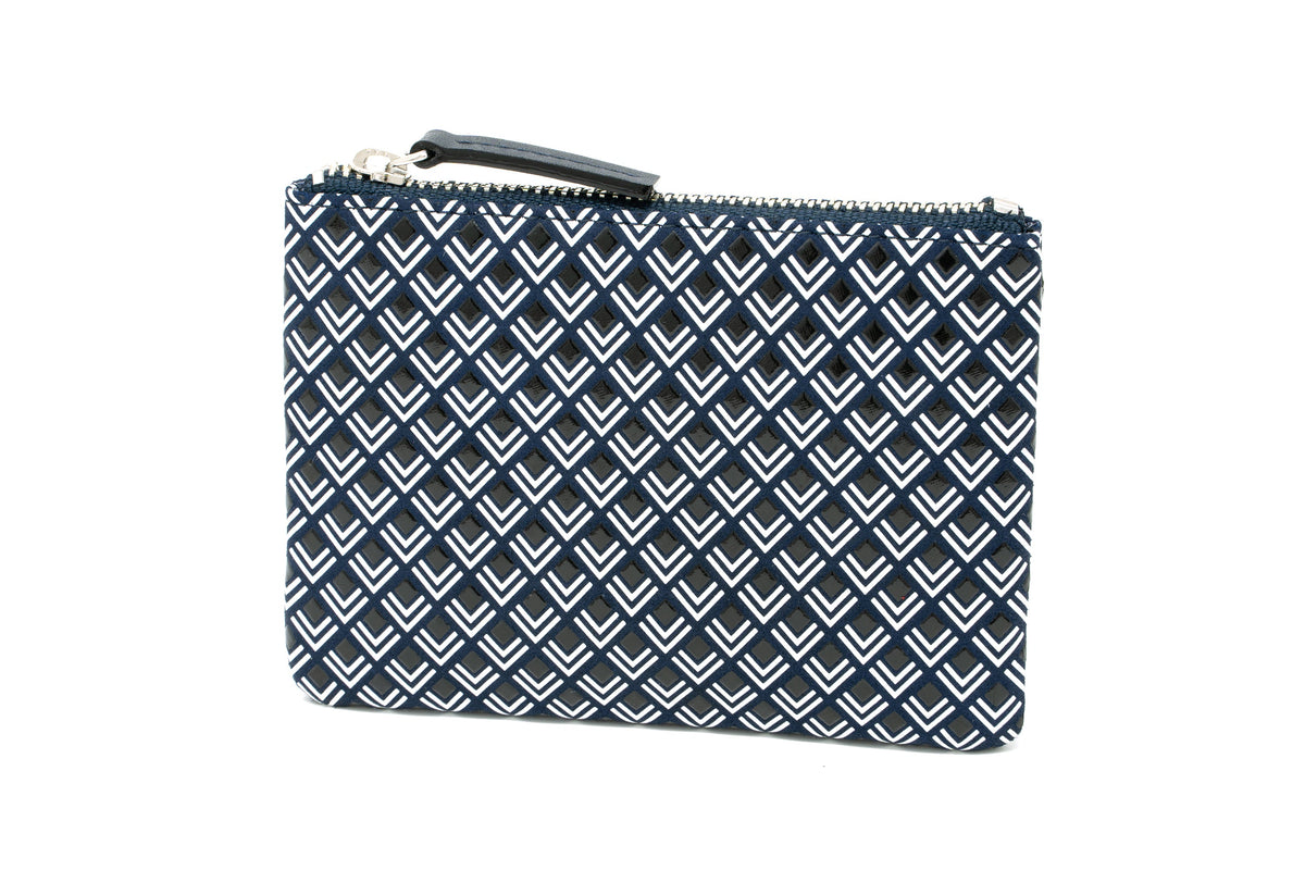 Rectangular navy key case with white chevron pattern and silver zipper pull on a white background.