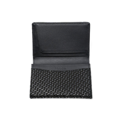 Black leather business card case with chevron pattern, open showing card slots