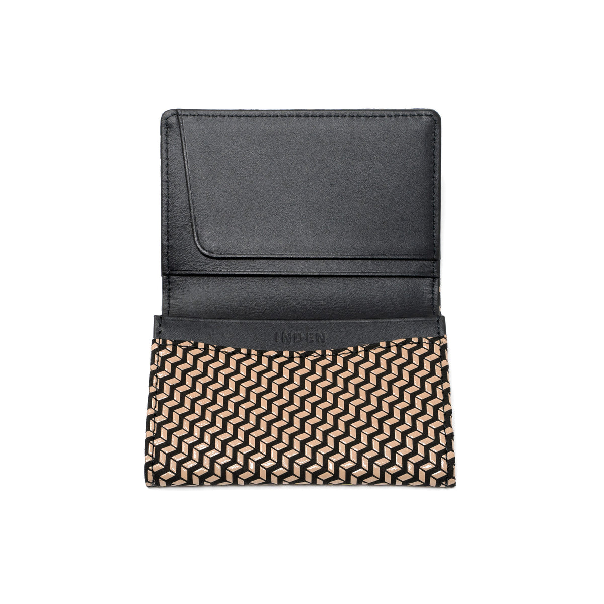 Open black leather business card case with a beige and black geometric chevron pattern on the lower half and the brand name Inden embossed inside.