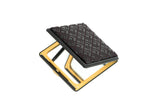 Compact diamond-shaped mirror with a textured dark brown patterned top and a gold-colored metal frame, shown partially open against a white background