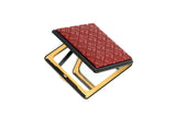 Square compact mirror with a gold-toned metal frame and a textured dark red cover featuring a geometric diamond pattern, shown slightly open on a white background.