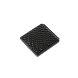 Square compact mirror with a glossy black herringbone patterned surface and silver-toned edges.