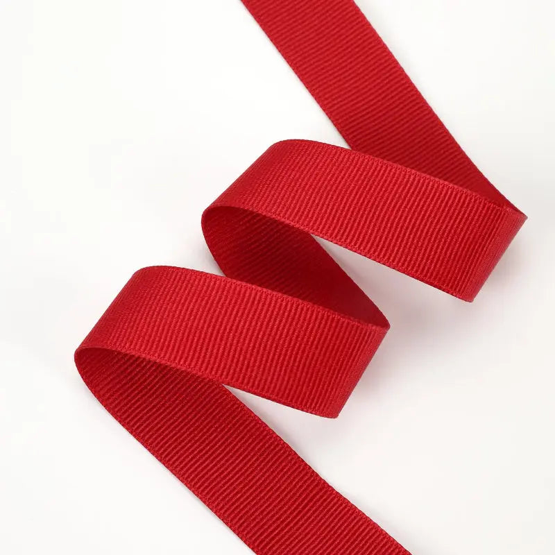 Scarlet textured grosgrain ribbon rolls in various widths