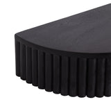 Corner close-up of a matte black rectangular side table with rounded edges and vertical ribbed detailing on the side panel, showing wood grain texture.